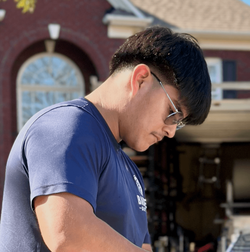 Badger Gutters crew member Santiago on a gutter job in east Charlotte, NC