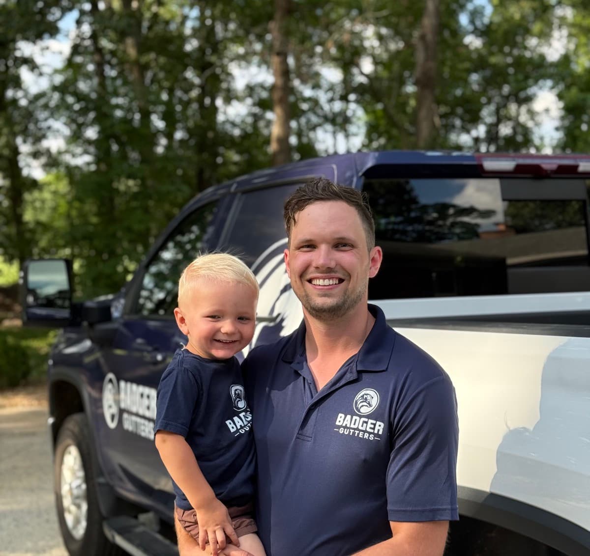 Ben Krupp, owner of Badger Gutters, with his son in Charlotte, NC
