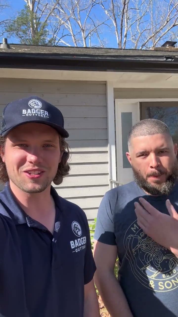 Ben Krupp with Omar S., a Badger Gutters customer, outside his home in Matthews, NC
